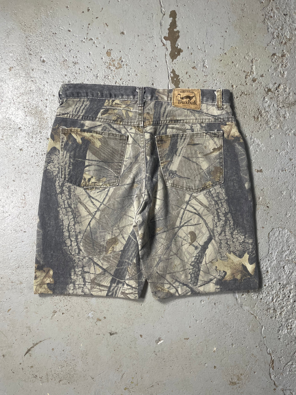 90s FADED CAMO JORTS